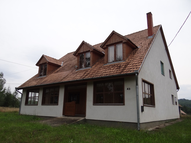 A house with a big plot of field