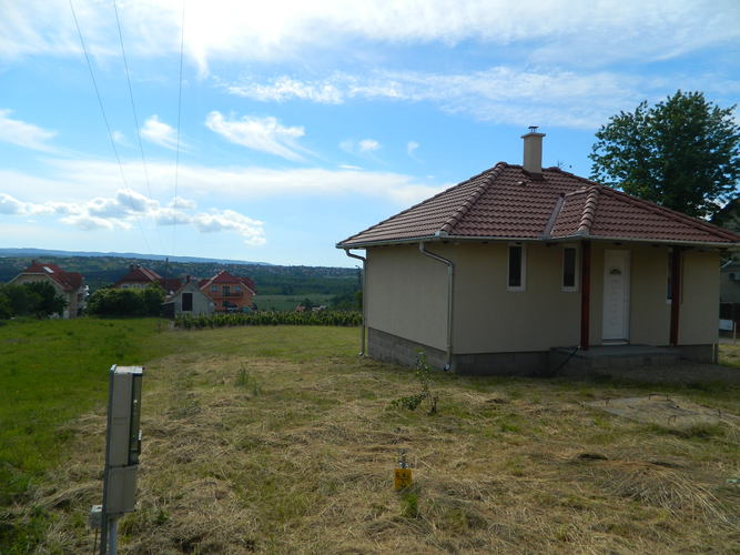 A plot of field with small house